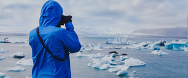 Person Taking Photo of Arctic Icebergs in Iceland - Source: Ditty_about_summer. Person Taking Photo of Arctic Icebergs in Iceland. Digital Image. Shutterstock, [Date Published Unknown]