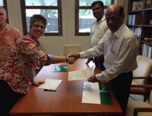 Memorandum of Understanding Signing from SMARTS2 Project - Source: [Author Unknown]. MOU signed UH with OUAT. Digital Image. [Source Unknown], [Date Published Unknown]