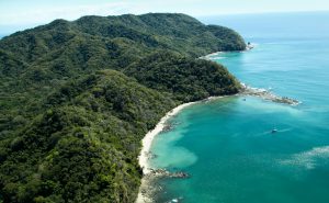 Ballena Bay Coast - Source: Freed, Tami. Lush Jungle Covered Mountains Stretch Out into the Gulf of Nicoya Next to the Rocky and Sandy Beach of Ballena Bay in Costa Rica. Digital Image. Shutterstock, [Date Published Unknown]